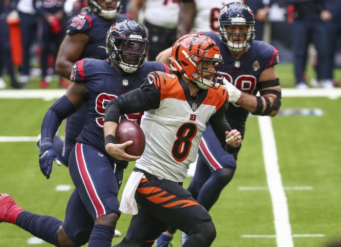 Cincinnati Bengals quarterback Brandon Allen (8) runs the ball against the Houston Texans during the fourth quarter at NRG Stadium.